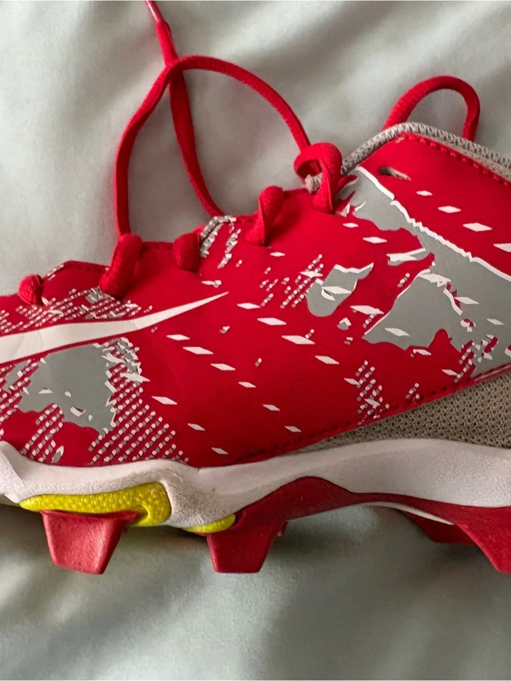 Nike Red and White Youth 4.5 Cleats with Yellow Sole Accents
